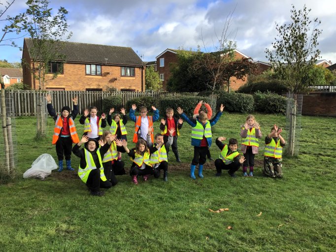 Pupils from Belvoirdale Primary School plant spring bulbs in Coalville Park